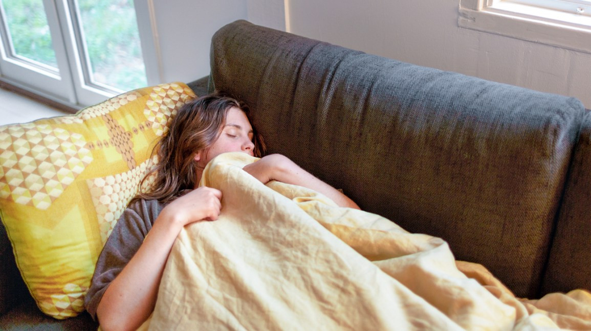 Woman-sleeping-on-sofa-1296x728-header.jpg