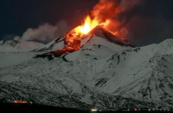 Italy’s Mount Etna spews lava down snow-covered slopes